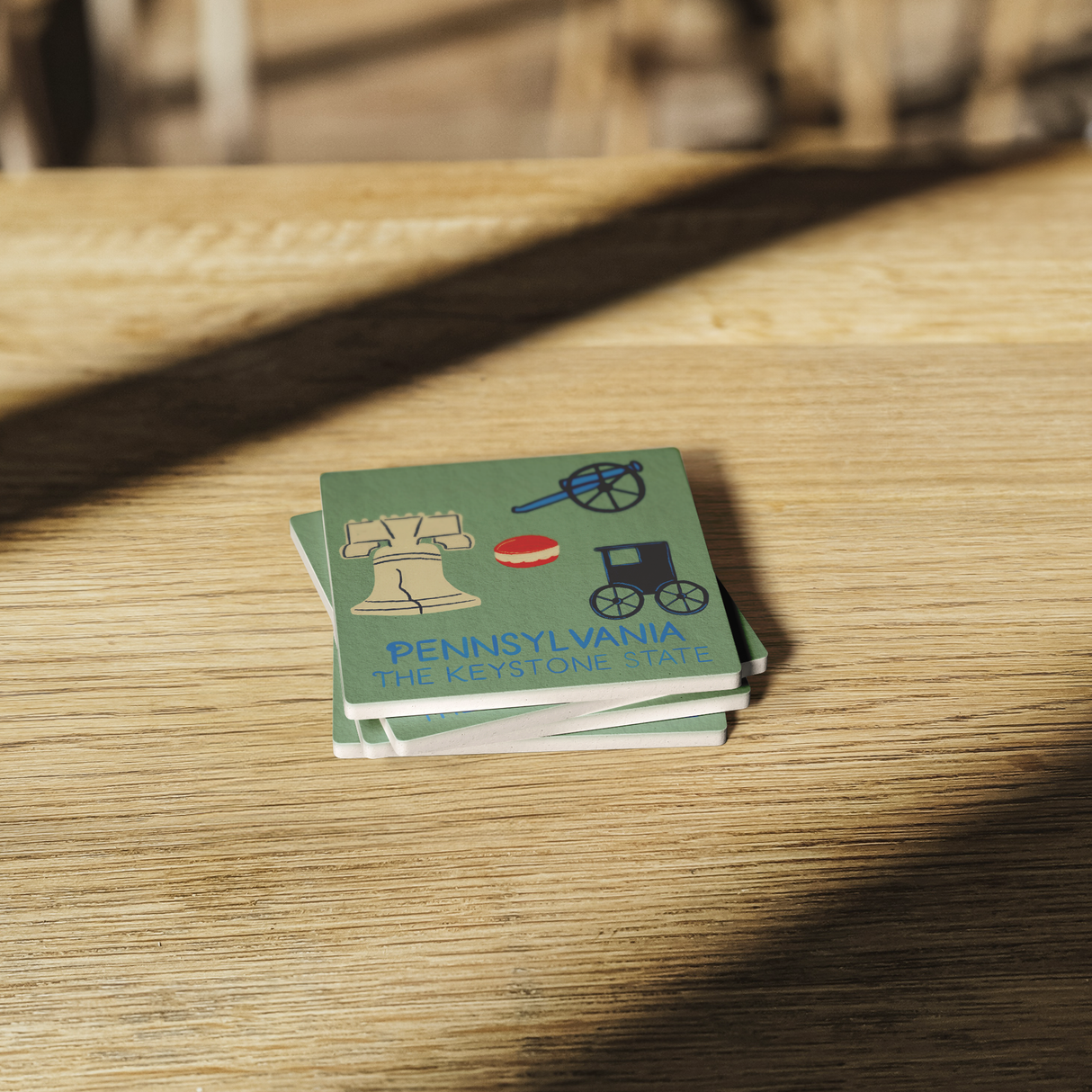 Stone_Coaster_-_Pennsylvania_Landmarks_SquareStoneCoaster_WoodTable_AS_Mockup.png_15452549
