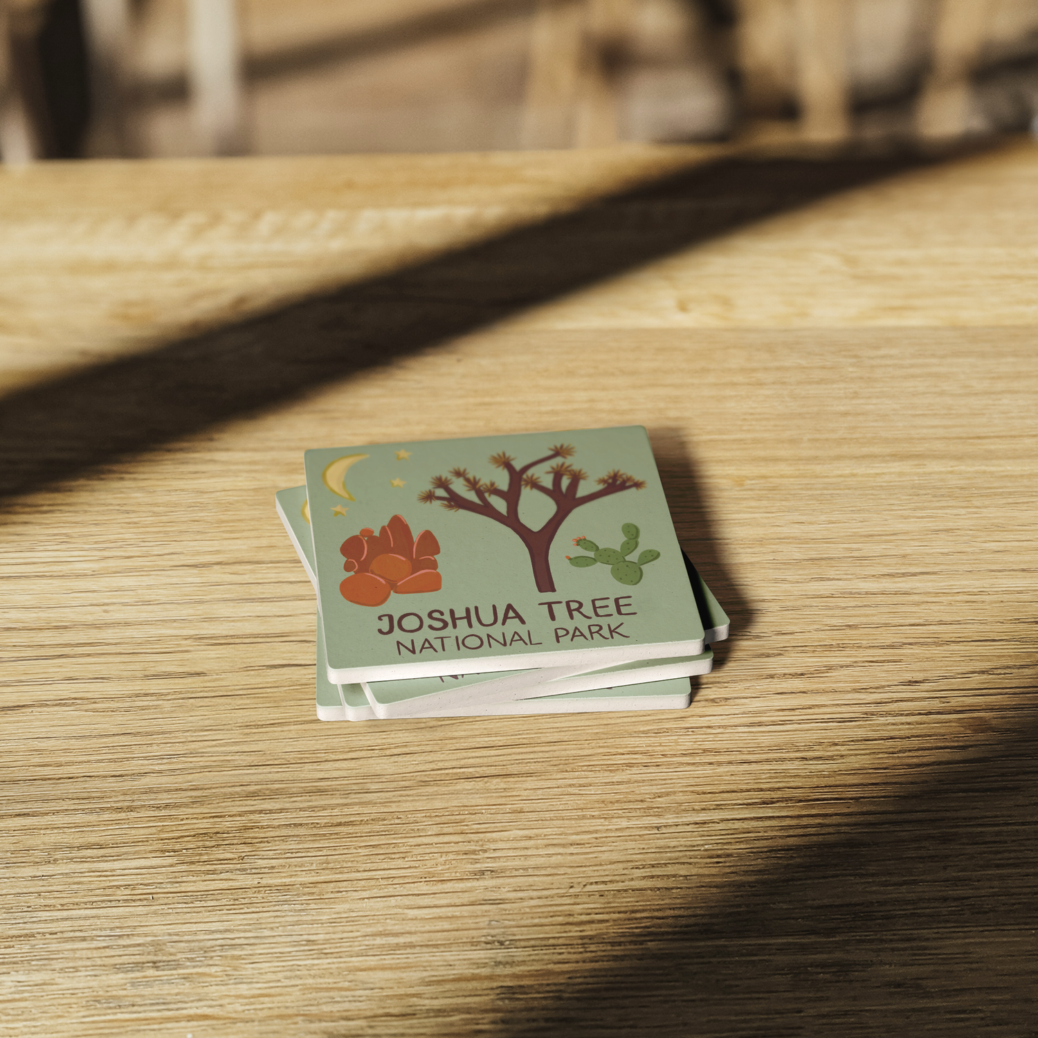 Stone_Coaster_-_Joshua_Tree_NP_Landmarks_SquareStoneCoaster_WoodTable_AS_Mockup.png_15452513