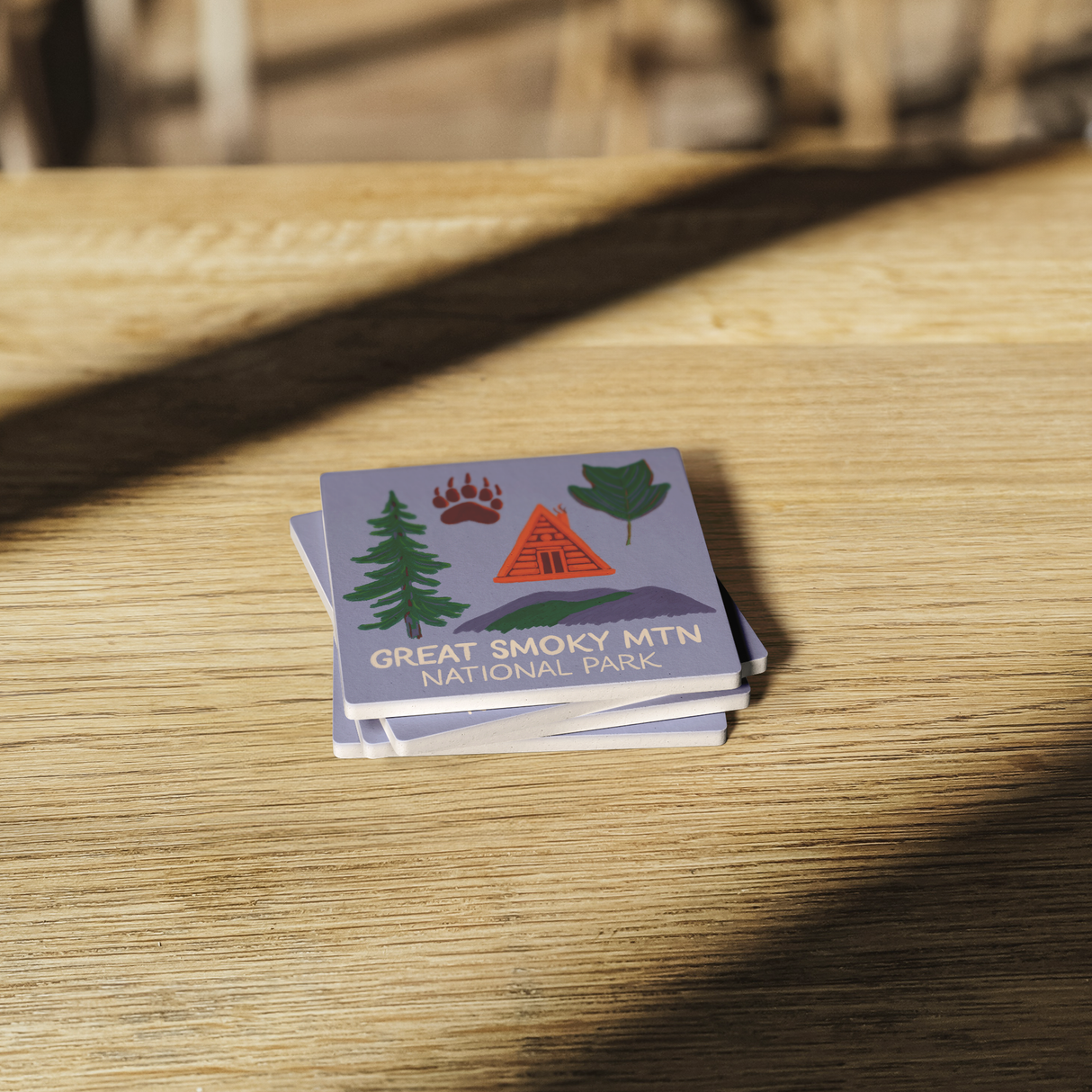 Stone_Coaster_-_Smoky_Mtn_NP_Landmarks_SquareStoneCoaster_WoodTable_AS_Mockup.png_15452642